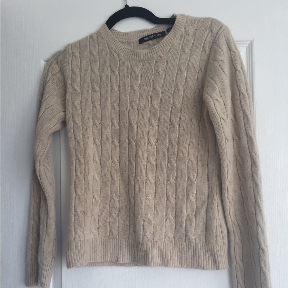 Cream cable knit sweater.